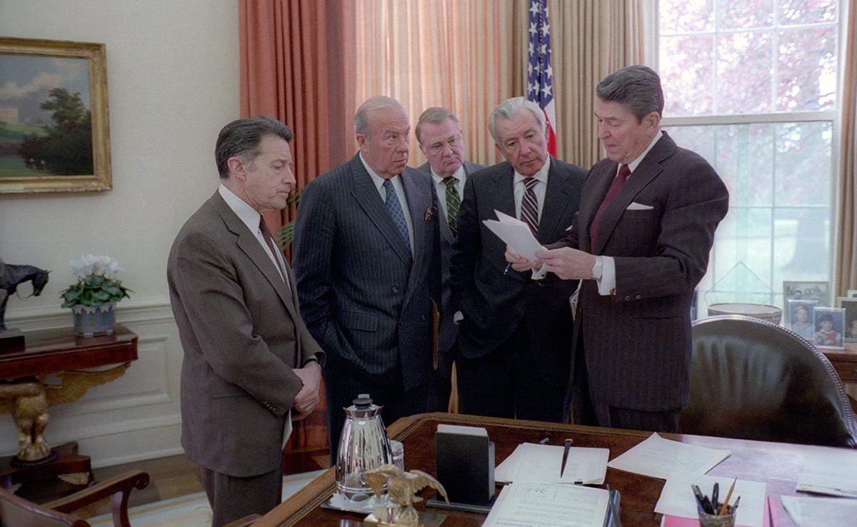 President Reagan meets with Caspar Weinberger, George Shultz, Ed Meese, and Don Regan in the Oval Office to discuss the President’s remarks on the Iran-Contra Affair